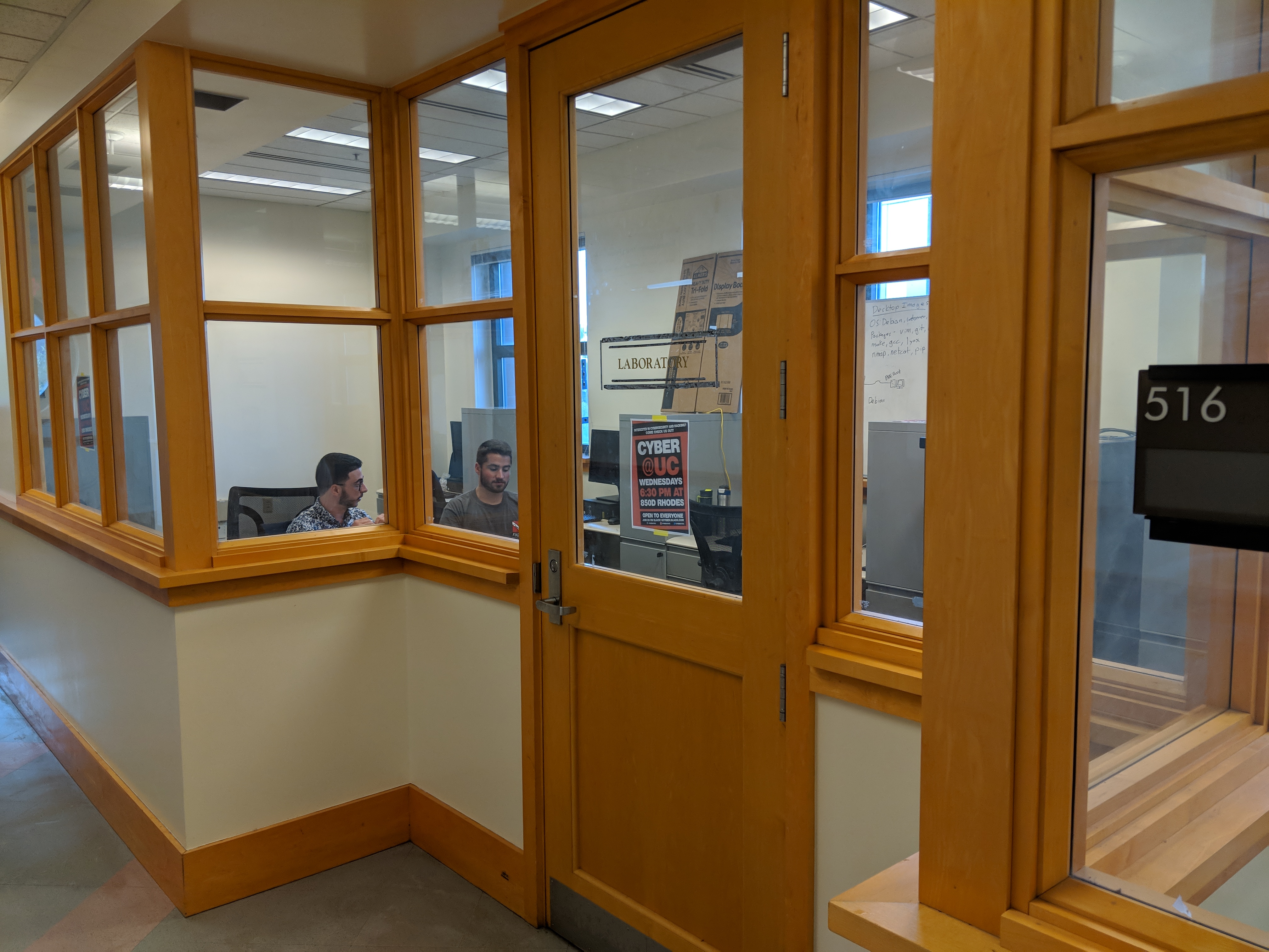 The front door to our lab room, with two students working inside