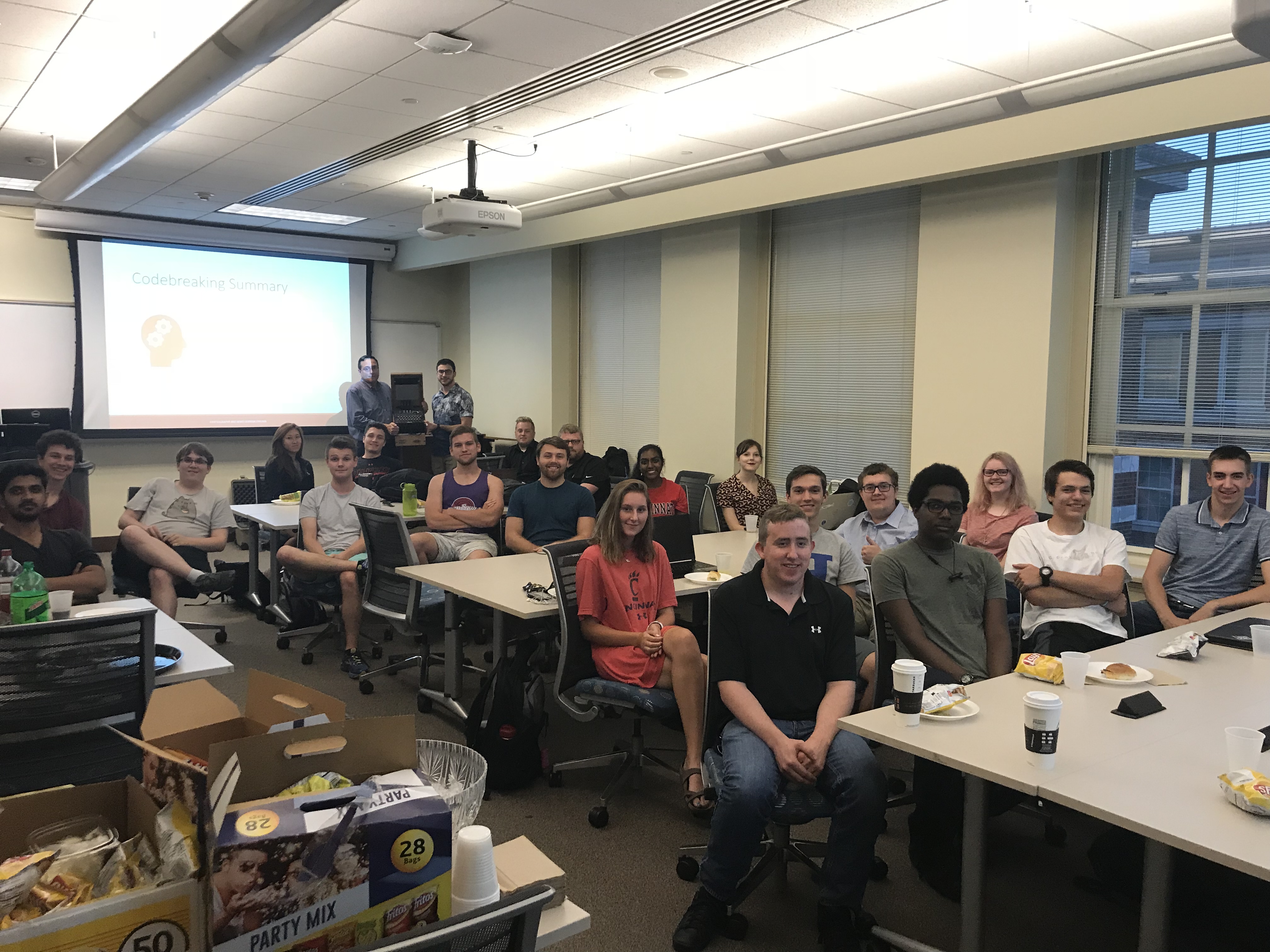 A classroom full of students smiling for the camera